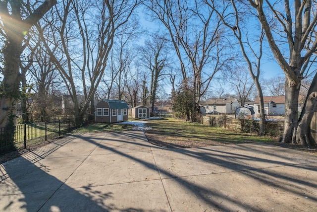 ranch-style house with a storage unit and a front yard