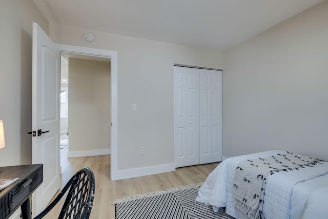 bedroom with a closet and light wood-type flooring