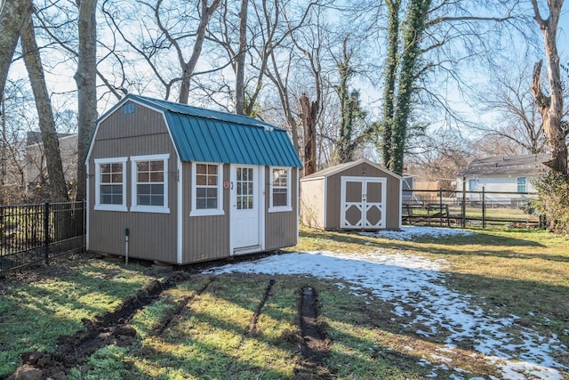 view of outbuilding with a lawn