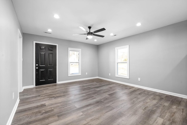 interior space featuring ceiling fan, hardwood / wood-style floors, and a wealth of natural light