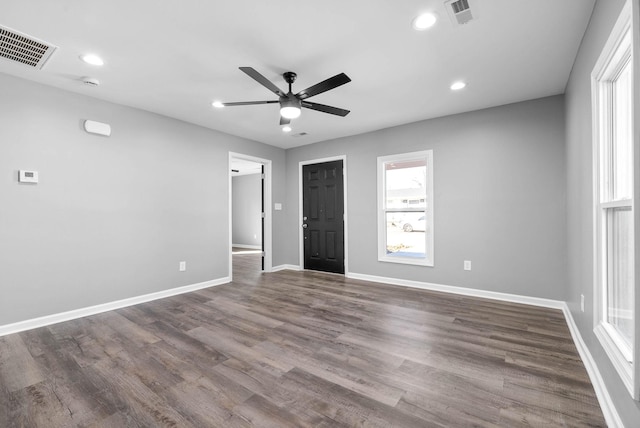 unfurnished room with ceiling fan and dark hardwood / wood-style floors