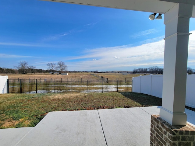 view of patio / terrace with a rural view