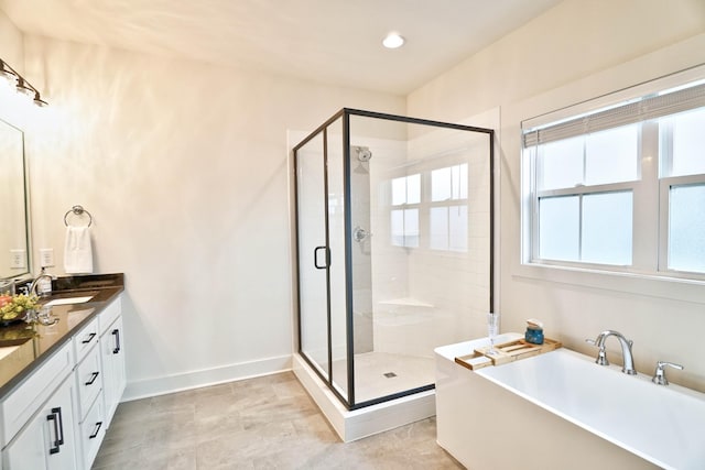 bathroom featuring vanity and plus walk in shower