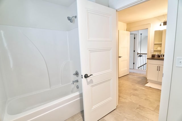 bathroom featuring shower / bathing tub combination and vanity