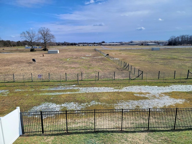 view of yard with a rural view