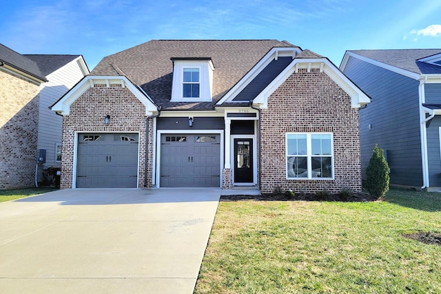 view of front facade featuring a front lawn and a garage