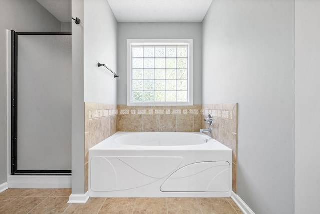 bathroom featuring plus walk in shower and tile patterned floors