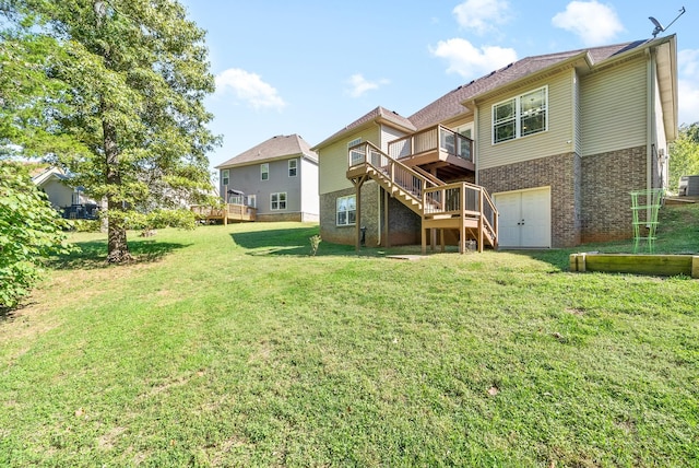 rear view of property with central AC unit, a deck, a garage, and a lawn