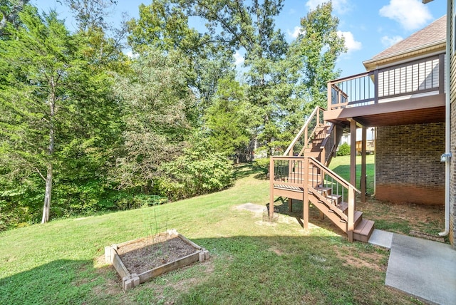 view of yard featuring a wooden deck