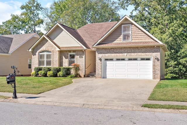 view of front of house featuring a front lawn and a garage