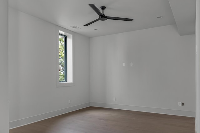 empty room featuring ceiling fan and wood-type flooring