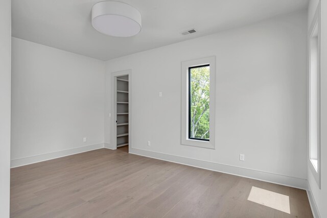 spare room featuring light hardwood / wood-style flooring