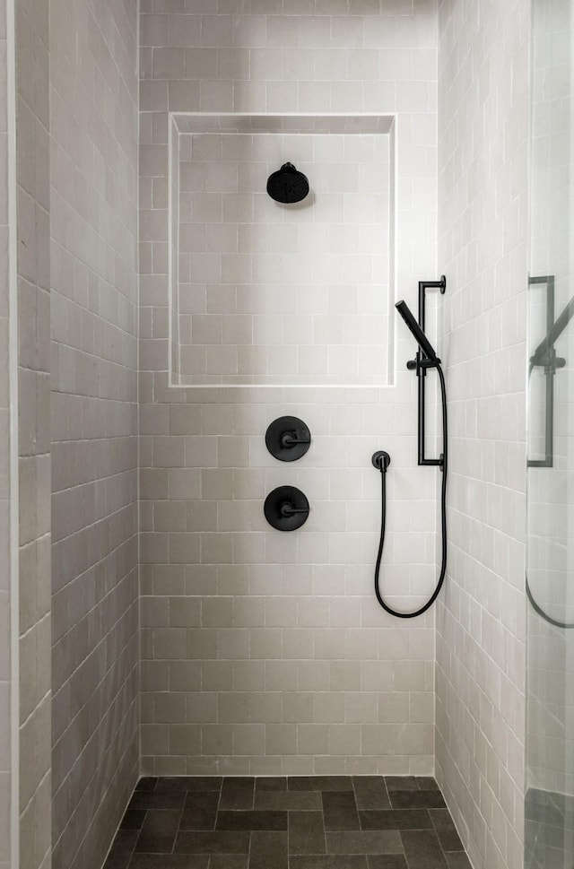 bathroom with a tile shower