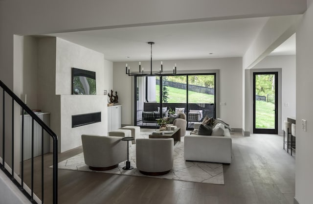 living room featuring a chandelier and hardwood / wood-style flooring