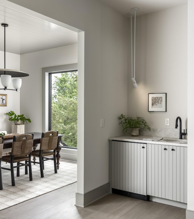 interior space featuring sink and light hardwood / wood-style floors