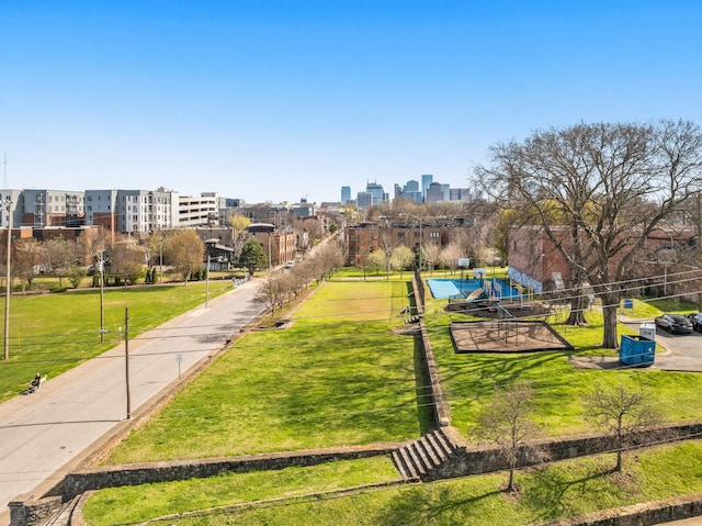 view of property's community with a yard