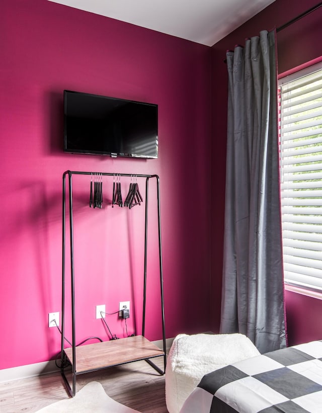 bedroom with hardwood / wood-style flooring