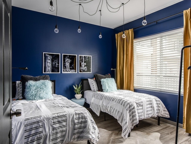 bedroom featuring wood-type flooring