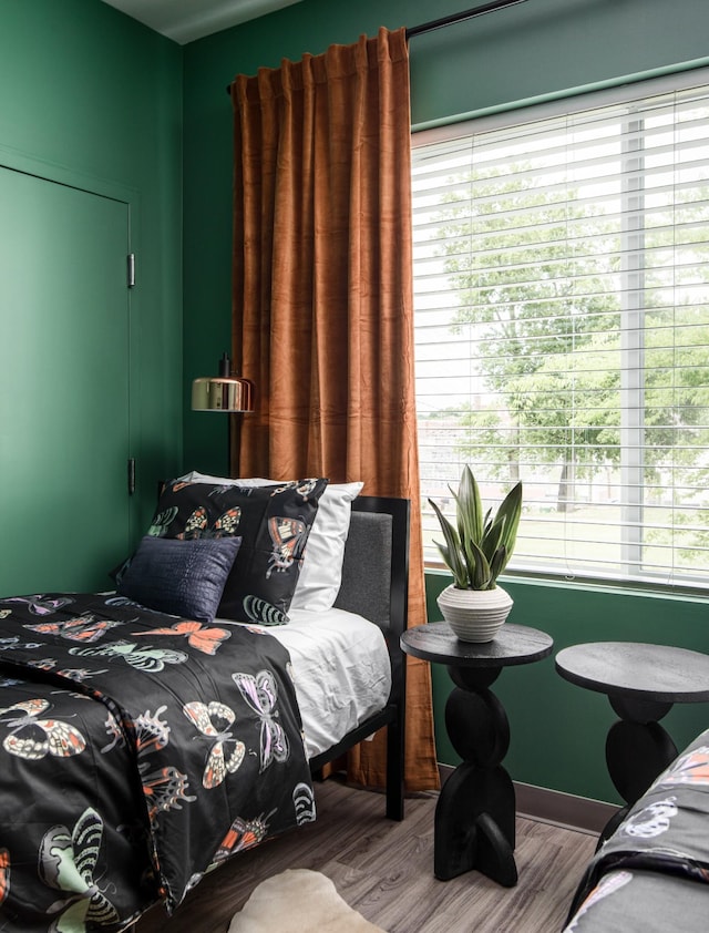 bedroom with hardwood / wood-style floors