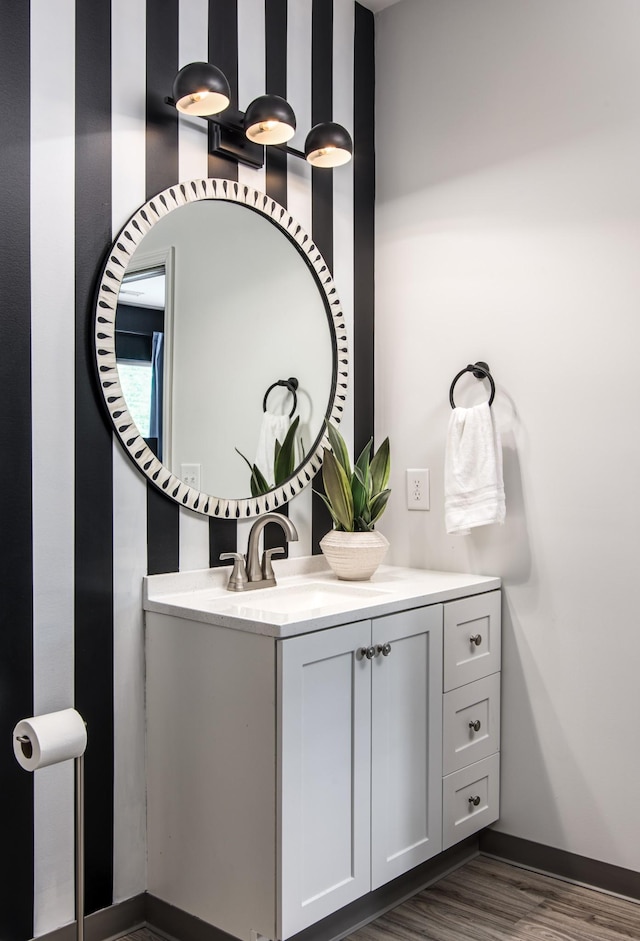 bathroom with hardwood / wood-style flooring and vanity