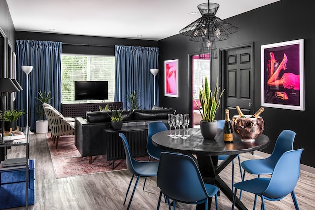 dining space featuring wood-type flooring