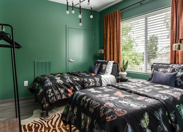 bedroom featuring hardwood / wood-style flooring