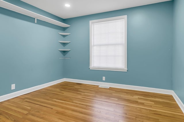 empty room featuring hardwood / wood-style flooring