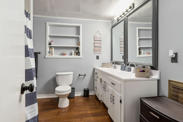 bathroom with toilet, vanity, wood-type flooring, and crown molding