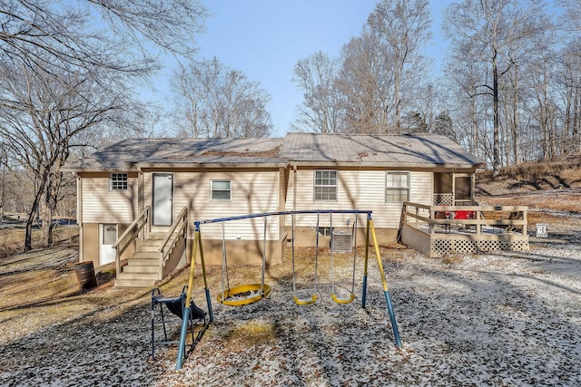 back of property featuring a wooden deck and central AC