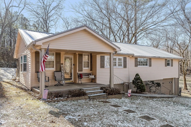 view of front of house with a porch and a garage