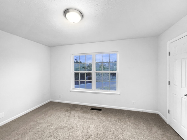 empty room featuring carpet