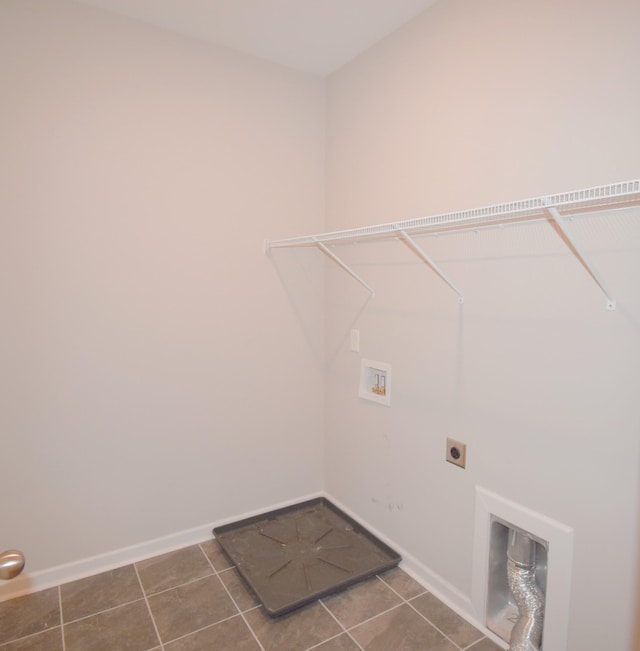 laundry area featuring washer hookup, dark tile patterned floors, and hookup for an electric dryer