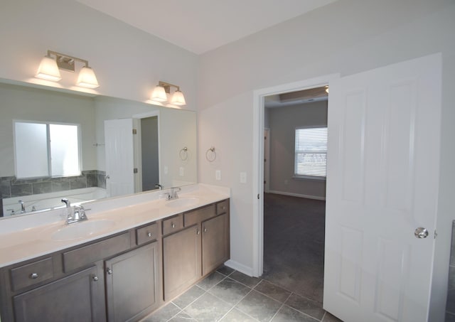 bathroom with a bath and vanity