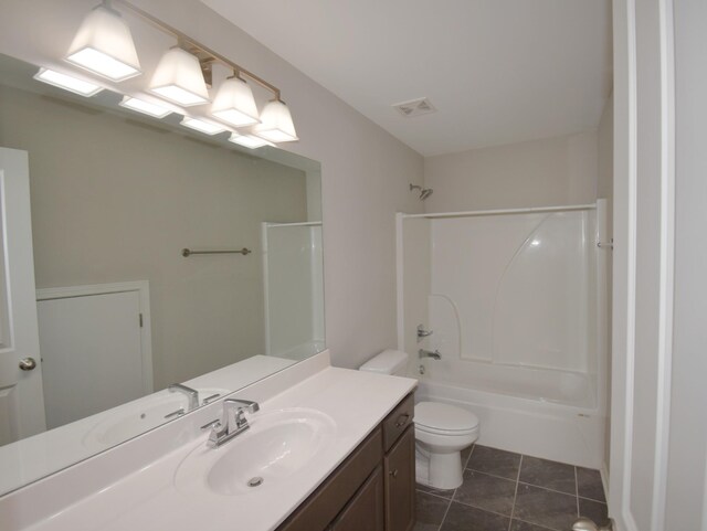 full bathroom featuring toilet, tile patterned flooring,  shower combination, and vanity