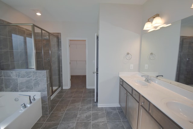 bathroom with tile patterned floors, vanity, and plus walk in shower