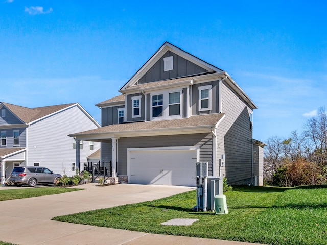 craftsman-style home with a front yard, covered porch, and a garage