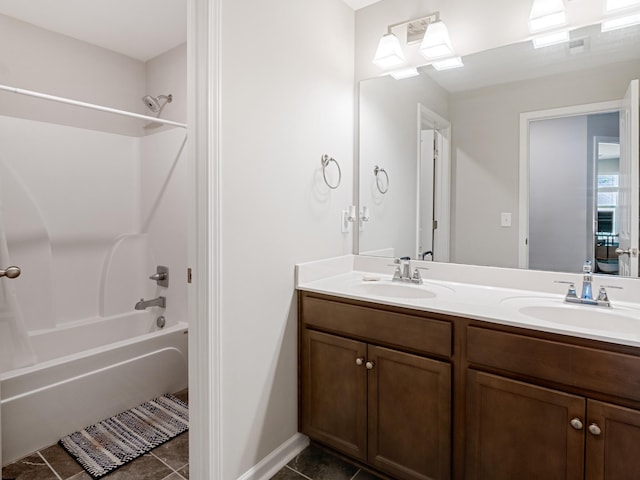 bathroom with bathtub / shower combination, tile patterned flooring, and vanity