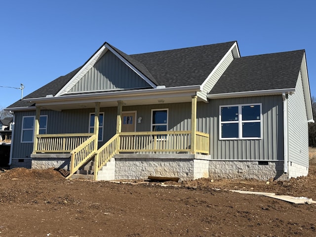 view of front of property featuring a porch, crawl space, and a shingled roof