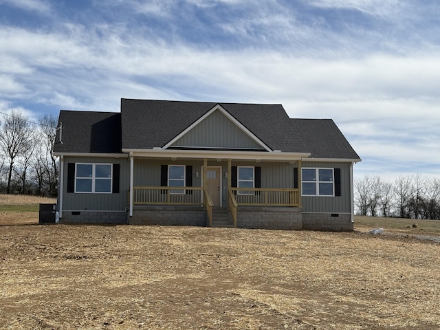 view of front of property with crawl space, a shingled roof, and a porch