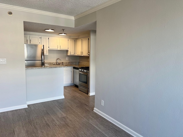 kitchen featuring white cabinetry, appliances with stainless steel finishes, dark hardwood / wood-style flooring, a textured ceiling, and sink