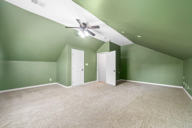 bonus room with carpet floors, ceiling fan, and vaulted ceiling