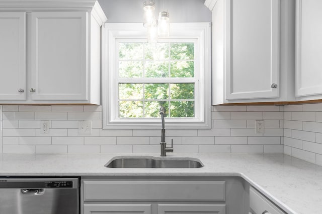 kitchen featuring dishwasher, decorative backsplash, sink, white cabinetry, and light stone counters