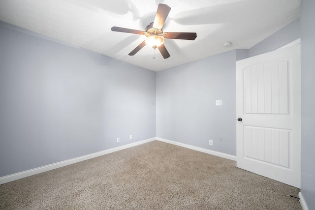 empty room with carpet floors and ceiling fan