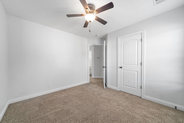 unfurnished bedroom with ceiling fan and carpet flooring