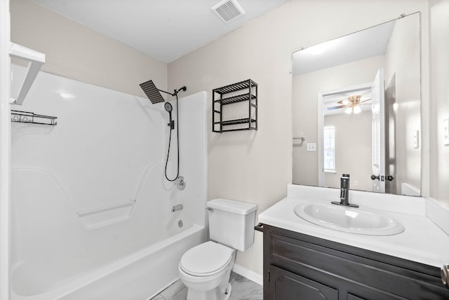 full bathroom featuring toilet, vanity, ceiling fan, and shower / washtub combination