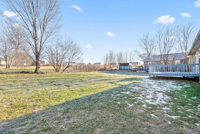 view of yard with a wooden deck