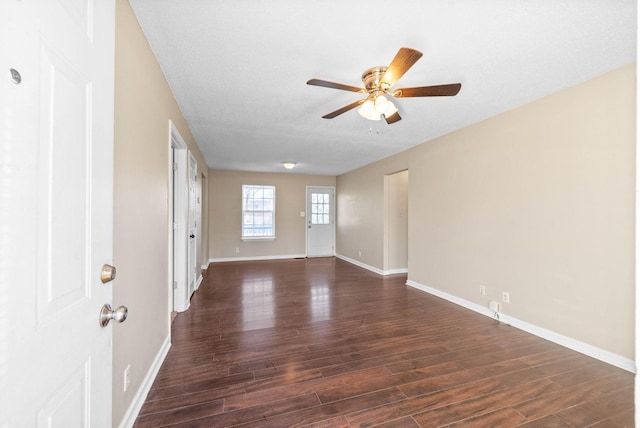 spare room with ceiling fan, a textured ceiling, and dark hardwood / wood-style floors