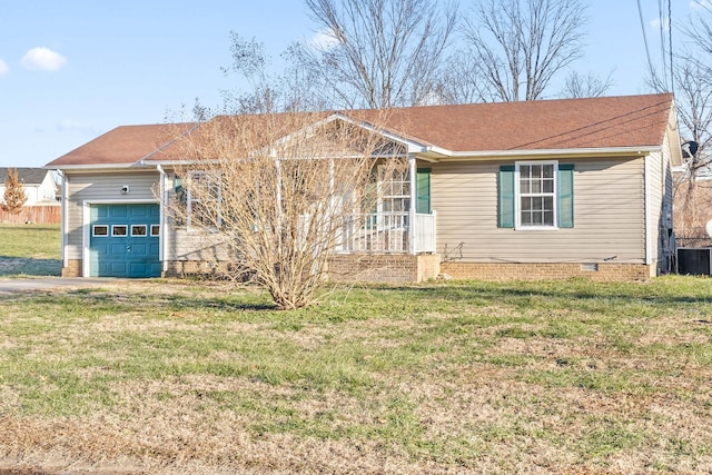 view of front of property with a garage, a front yard, and central air condition unit