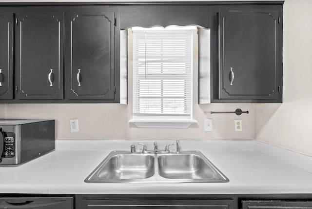 kitchen with dishwashing machine and sink