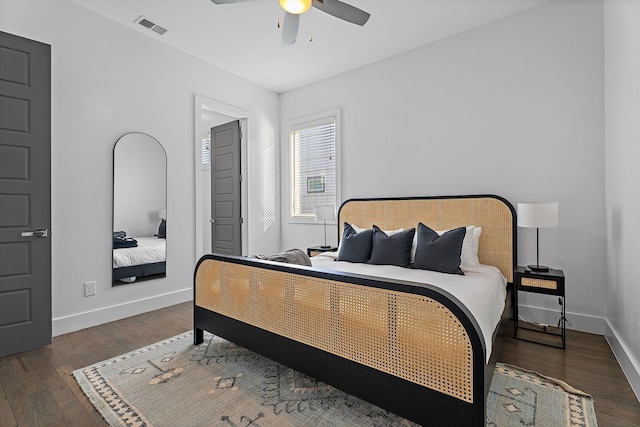 bedroom with ceiling fan and dark hardwood / wood-style floors